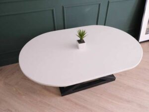 Central table, white wooden top, thick black steel frame, curved corners._88CU3KN5KJ