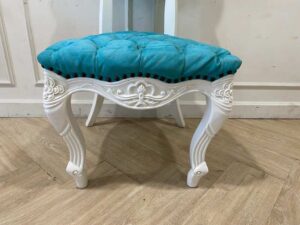 Single-seat Louis-style wooden chair with blue button-tufted fabric upholstery.