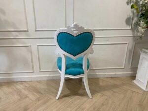 Single-seat Louis-style wooden chair with blue button-tufted fabric upholstery.