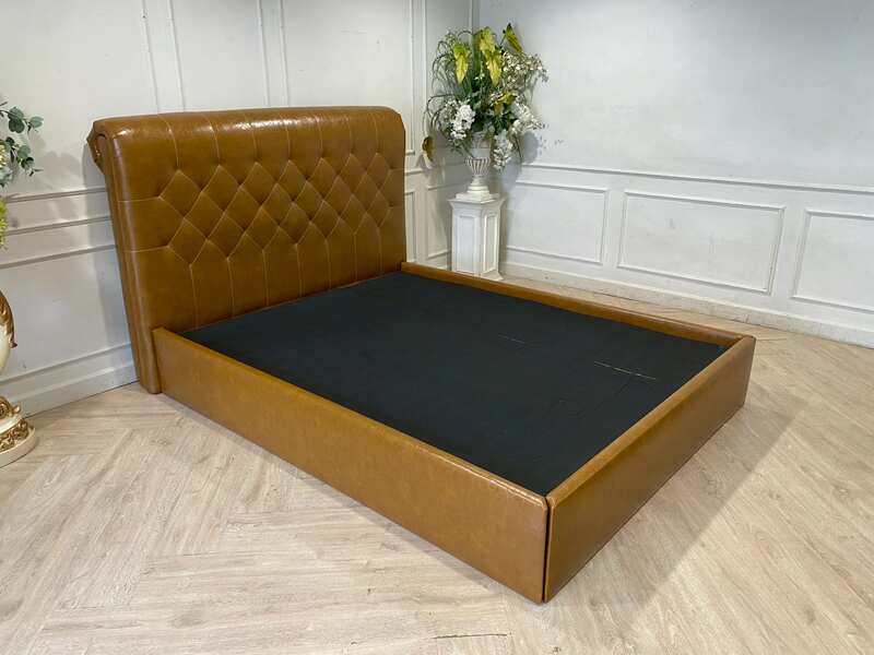 5-foot bed with leather cushions and brown button-tufted bolsters