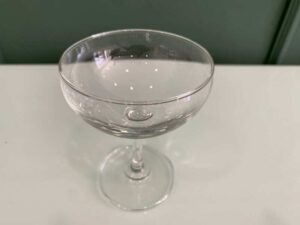 Wide-shaped champagne glass, IKEA Storhet model.
