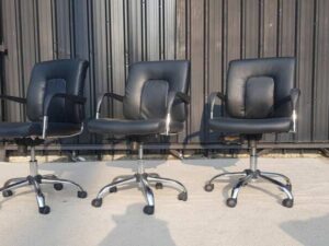 Igo brand office chair with leather upholstery and steel legs, black color.