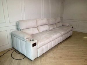 4-seater sofa bed with cream velvet upholstery. (1)