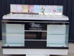 Glass display case, wooden cosmetic display case with 2 glass doors and 3 wooden doors, black color.