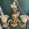 Vintage style chandelier with rose pattern, gold color.