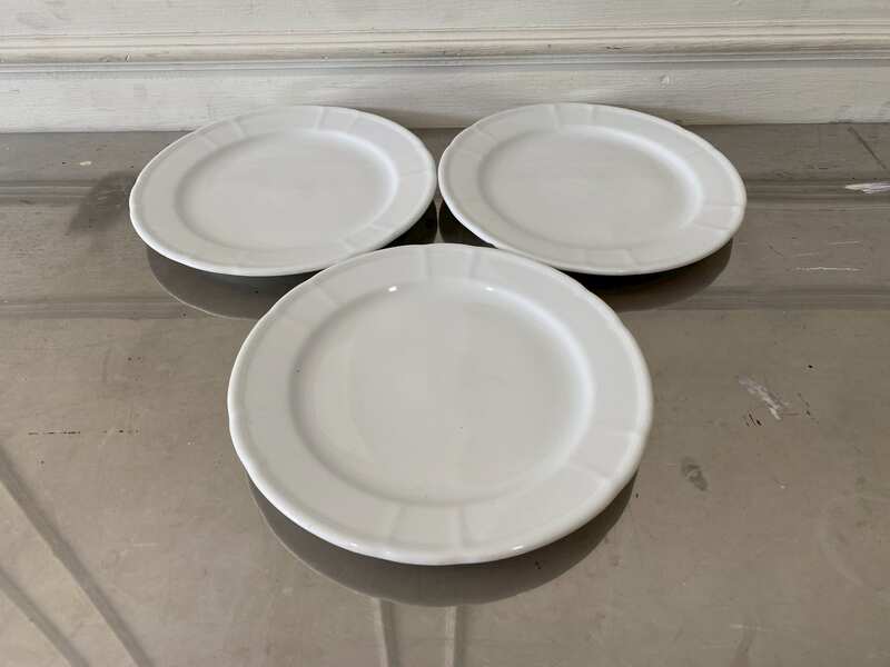 White ceramic dinner plate, Royal Porcelain brand.