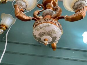 Chandelier, glass pendant lamp, floral pattern, brown and white color.