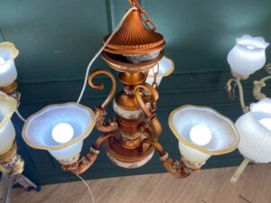 Chandelier, glass pendant lamp, floral pattern, brown and white color.