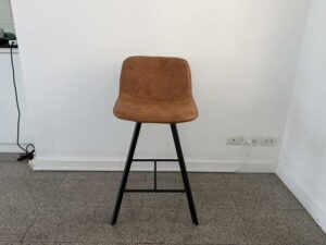 Brown leather bar stool with black wooden legs