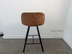 Brown leather bar stool with black wooden legs