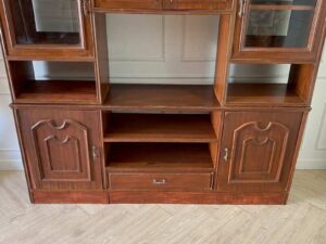 Wooden display cabinet with 6 doors, 7 compartments, and 1 drawer, brown color._A70ADGOY7I