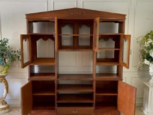 Wooden display cabinet with 6 doors, 7 compartments, and 1 drawer, brown color._A70ADGOY7I