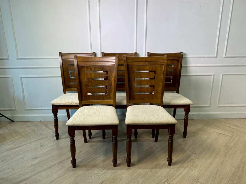 Vintage-style cream-colored wooden chair with fabric cushions