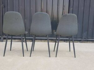 Chair with metal legs and dark gray fabric seat.