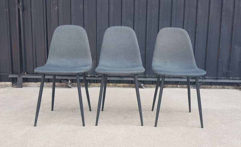Chair with metal legs and dark gray fabric seat.
