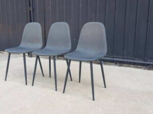 Chair with metal legs and dark gray fabric seat.
