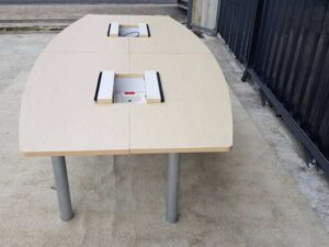 12-seat conference table, steel legs with power strip, light brown wood top (2)