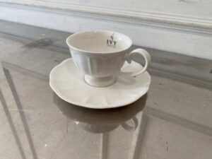 White ceramic coffee cup set with saucer.
