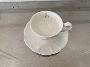 White ceramic coffee cup set with saucer.