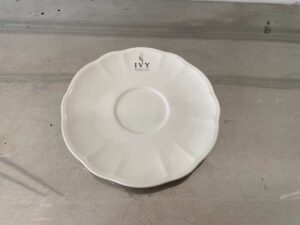 White ceramic coffee cup set with saucer.