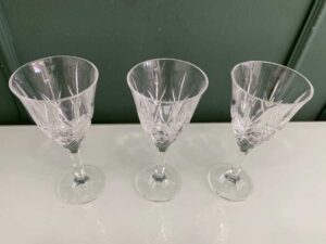 Crystal wine glass with a fan-shaped faceted pattern.