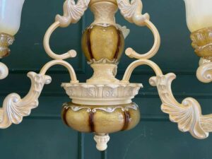 Cream-colored glass chandelier.