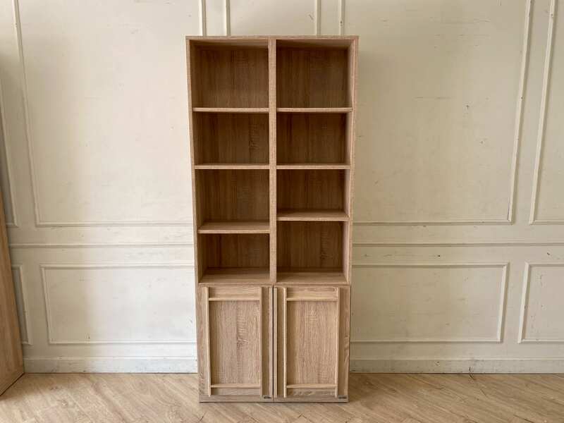 Light wood shelving unit with two lower doors, Koncept brand, Lybrary model.