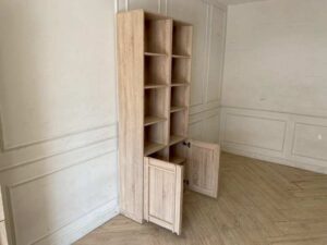 Light wood shelving unit with two lower doors, Koncept brand, Lybrary model.