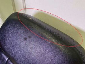 Facial massage bed, steel legs, black leather upholstery.