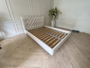 5-foot bed, leather upholstery, button-tufted, white.