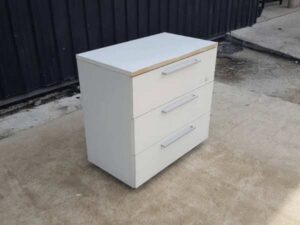 White wooden cabinet with 3 drawers