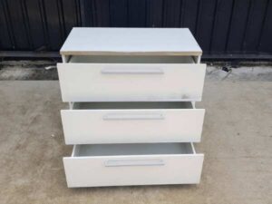 White wooden cabinet with 3 drawers