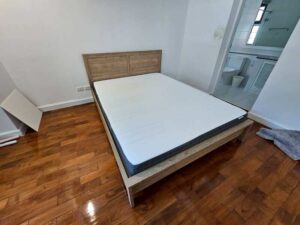 5-foot wooden bed, light brown, minimalist style.