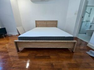 5-foot wooden bed, light brown, minimalist style.