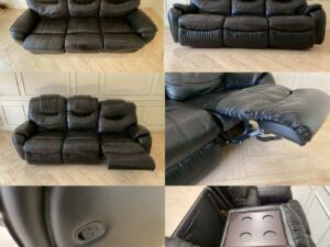 Black 3-seater leather sofa bed with a central cushion that folds down to become a cup holder._DDHQY5KRSU