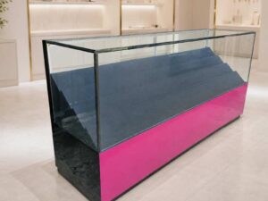 230 cm LED Glass Display Counter with Pink–Black Base and Tiered Shelves