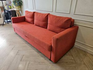 3-seater sofa bed, fabric upholstery, red-orange color, with under-seat storage.