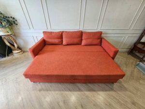 3-seater sofa bed, fabric upholstery, red-orange color, with under-seat storage.
