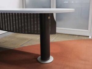Executive desk, L-shaped corner, light gray wood top, steel legs, has a steel plate to shield the view under the desk, brand UB.