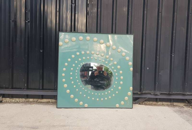 Dotted wall mirror with green background, square shape