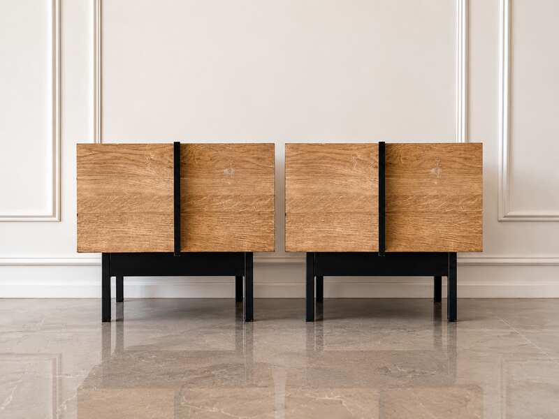 Modern style wooden bedside table set with black iron legs.
