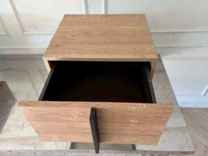 Modern style wooden bedside table set with black iron legs.