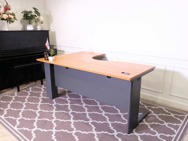 L-shaped corner work desk, brown wood top, gray steel legs, Rockworth brand.