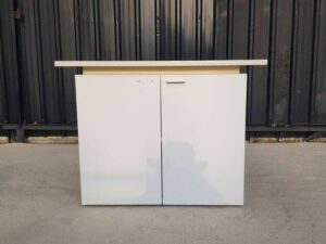 Two-door filing cabinet with wide wooden top, white color.