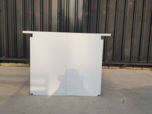 Two-door filing cabinet with wide wooden top, white color.