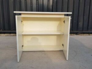 Two-door filing cabinet with wide wooden top, white color.