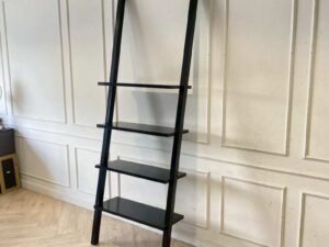 Black wooden ladder-shaped shelving unit