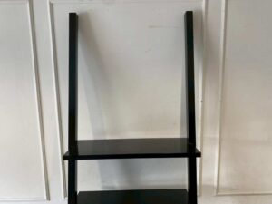 Black wooden ladder-shaped shelving unit