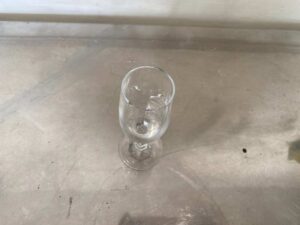 Clear stemmed wine glass, tall and slender.