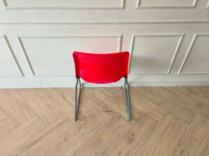 Plastic chair with metal legs, IKEA brand, SNILLE model.